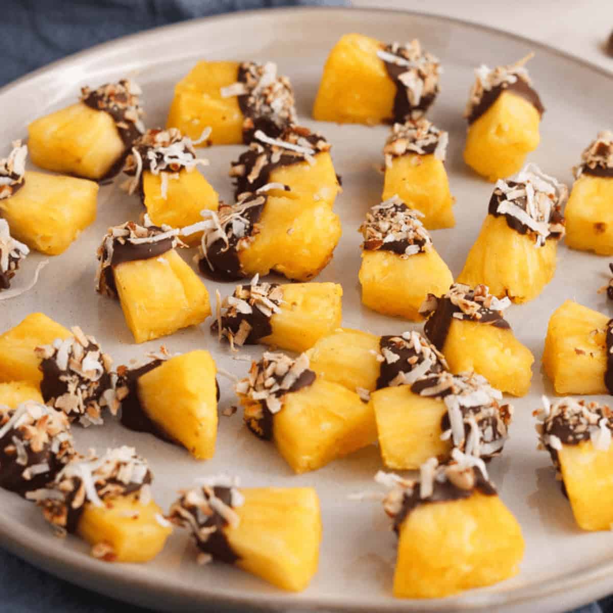 chocolate covered pineapple on plate