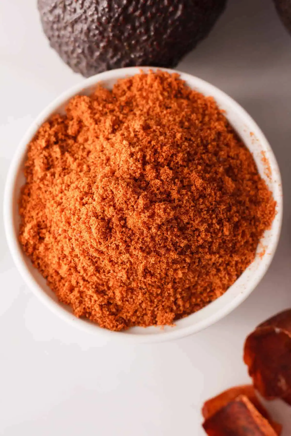 overhead image of avocado seed powder in bowl