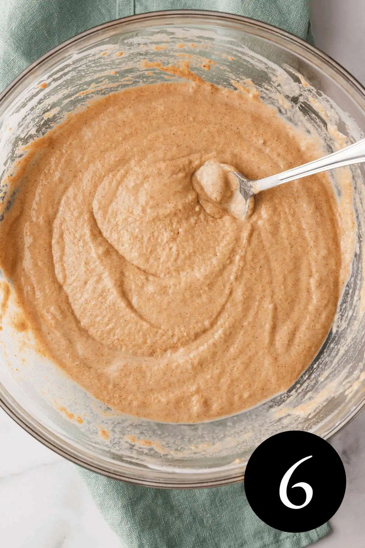 overhead image of pancake batter with number six in bottom right corner