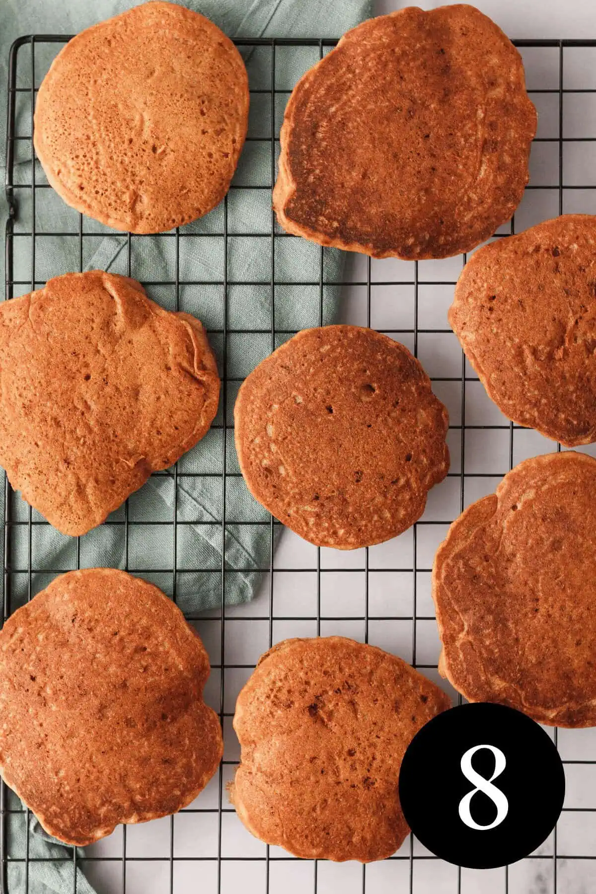 overhead image of popcorn pancakes on cooling rack with number eight in bottom right corner