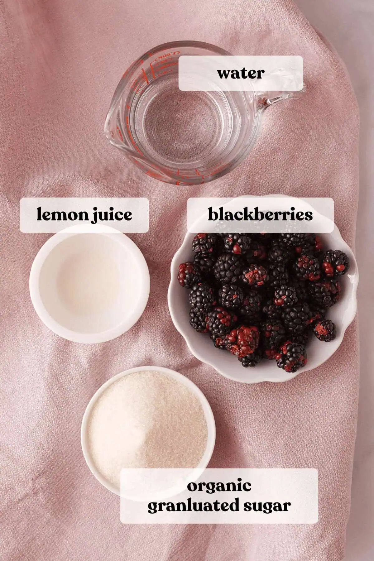 overhead image of ingredients on rose tea towel with text labels identifying each ingredient