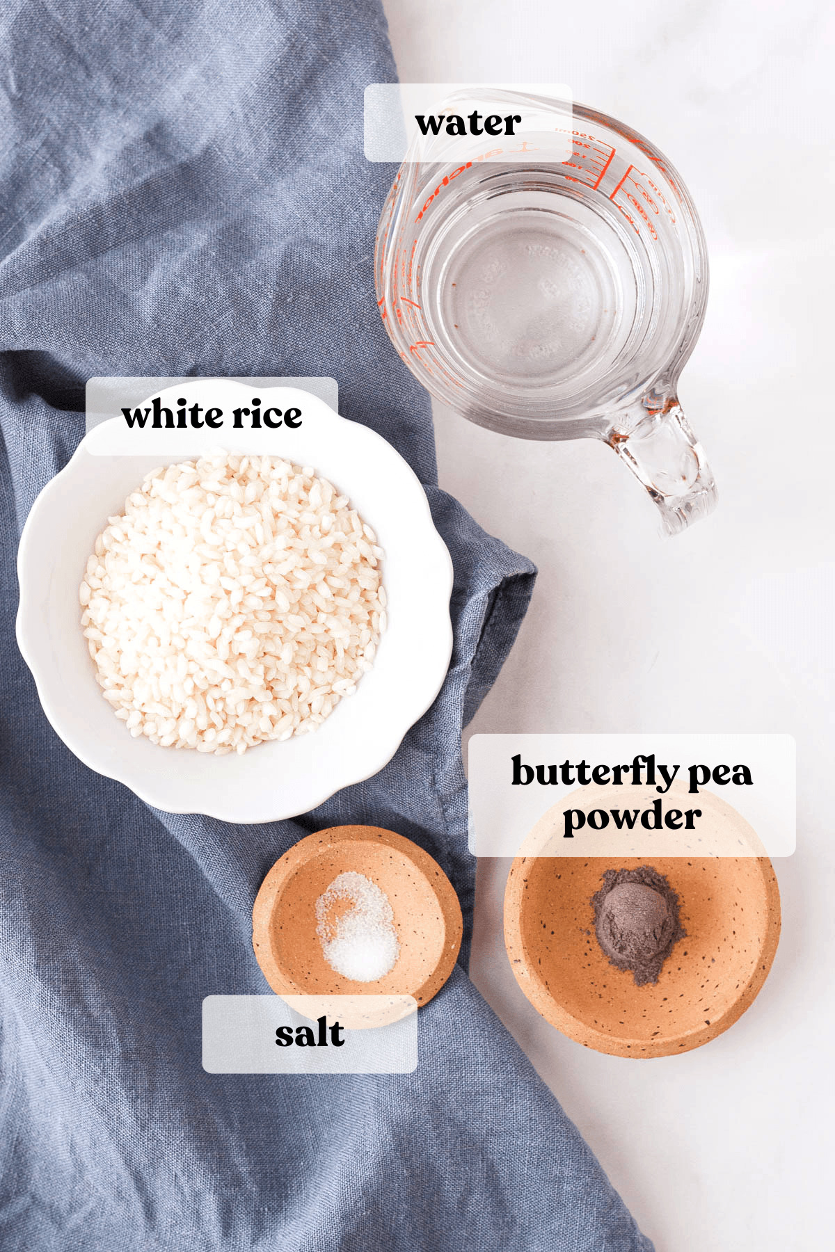 overhead image of butterfly pea rice ingredients with text labels