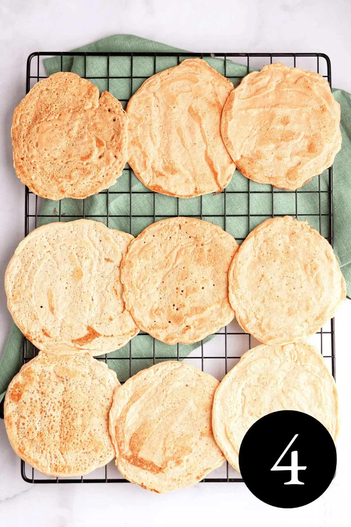 overhead image of red lentil tortillas on cooling rack with number four in bottom right corner