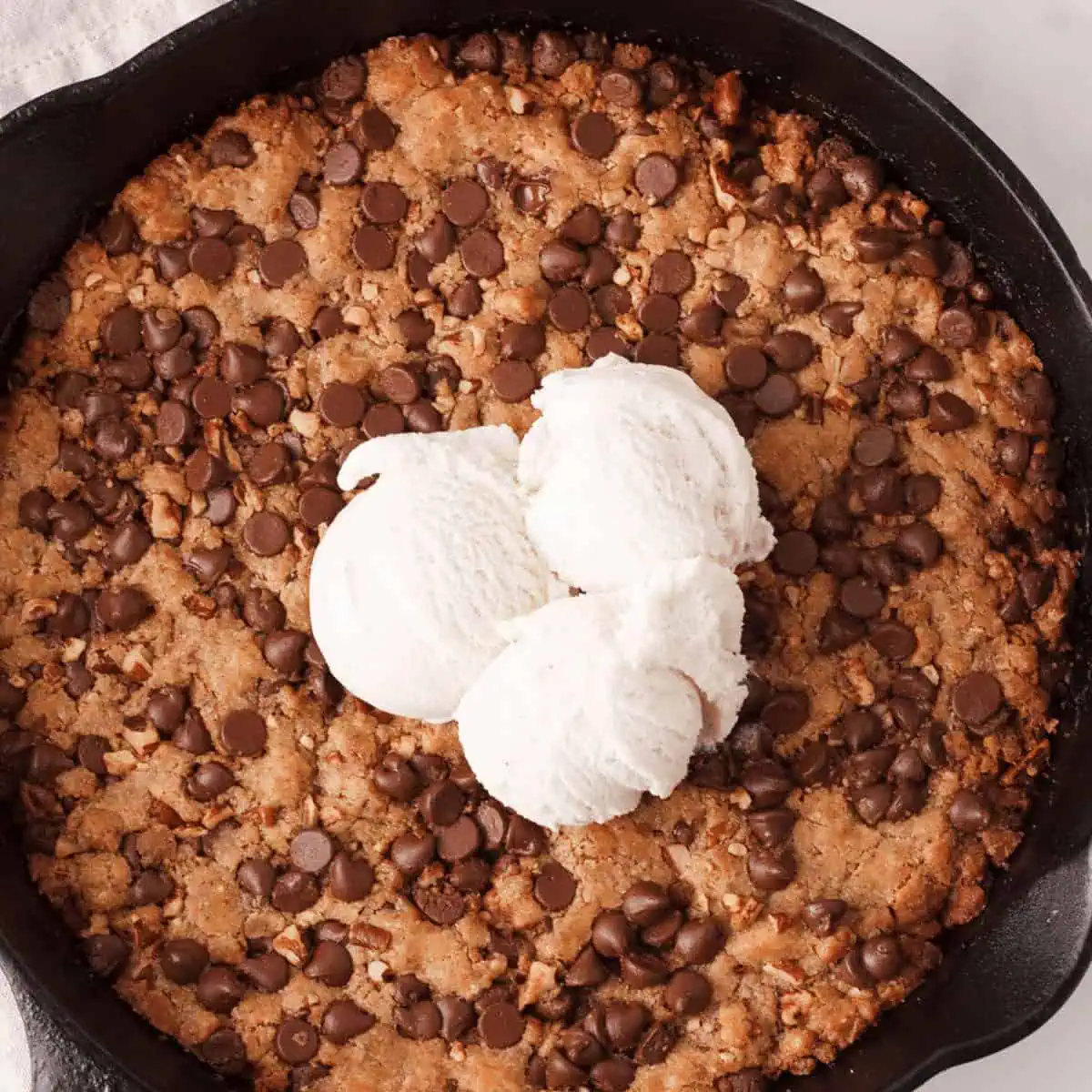 overhead closeup of vegan pizookie with ice cream on top