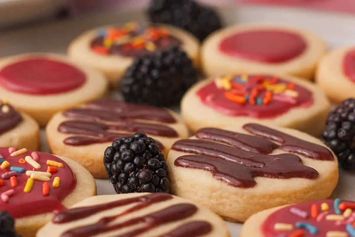 closeup of blackberry icing on shortbread cookies