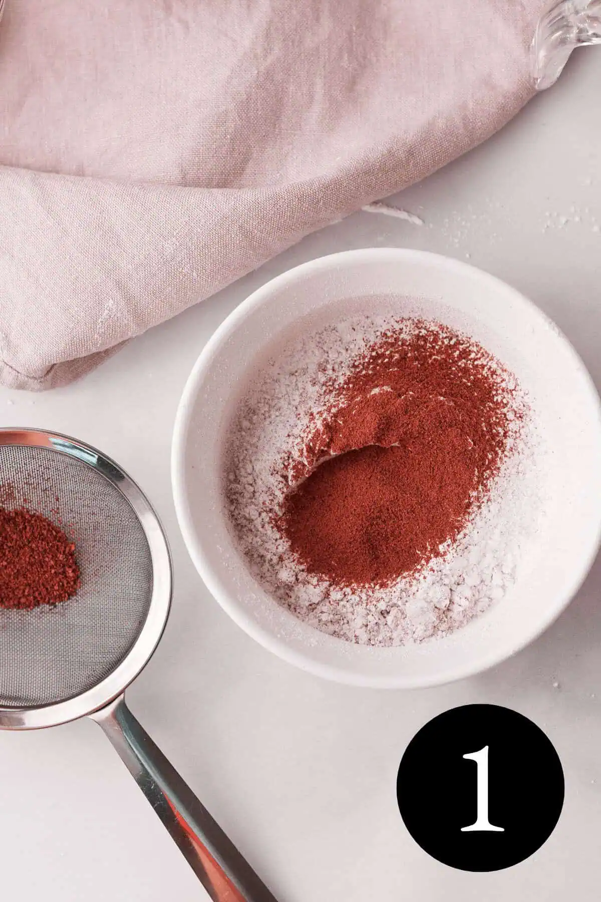 overhead image of powdered sugar and blackberry powder in white bowl and number one in bottom right corner