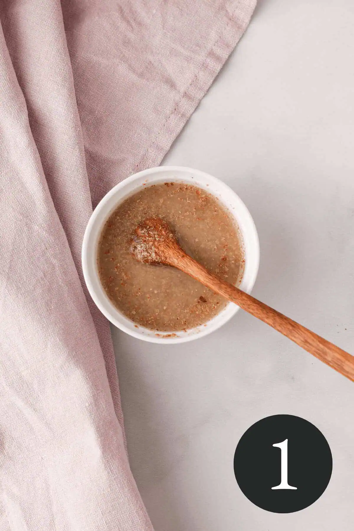 overhead image of flax egg in white bowl with number one in the bottom right corner