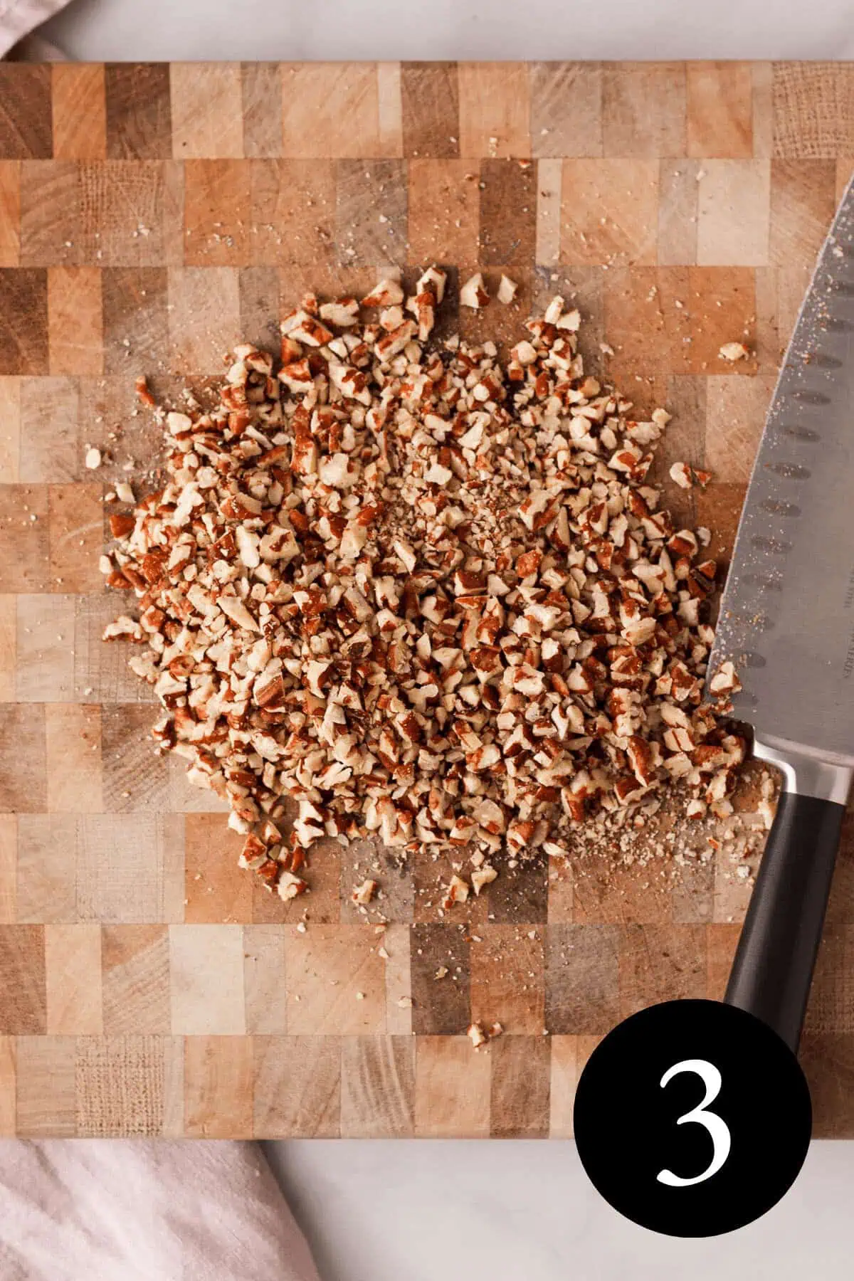 overhead image of chopped pecans on cutting board with number three in bottom right corner