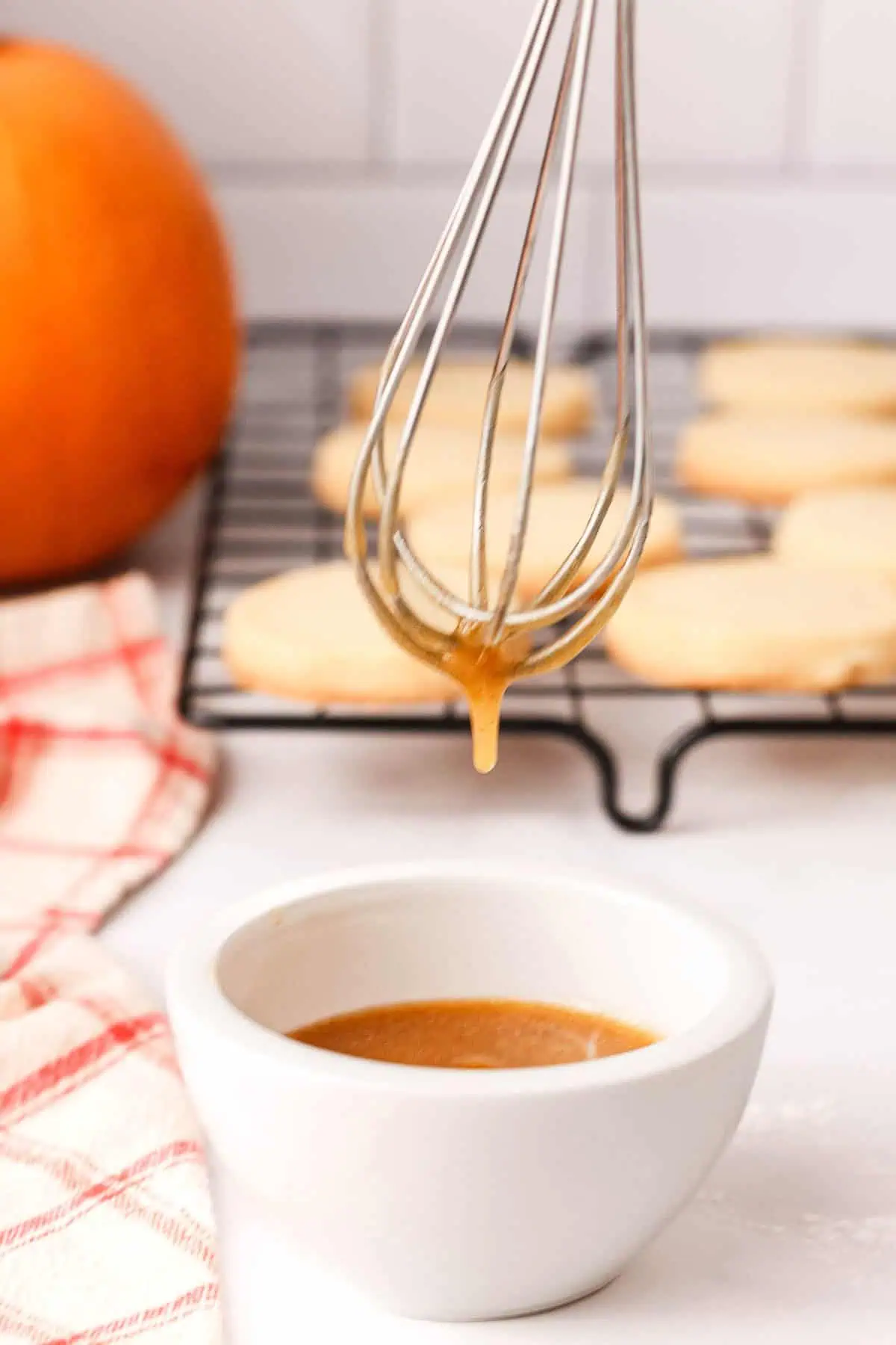 pumpkin icing dripping off whisk