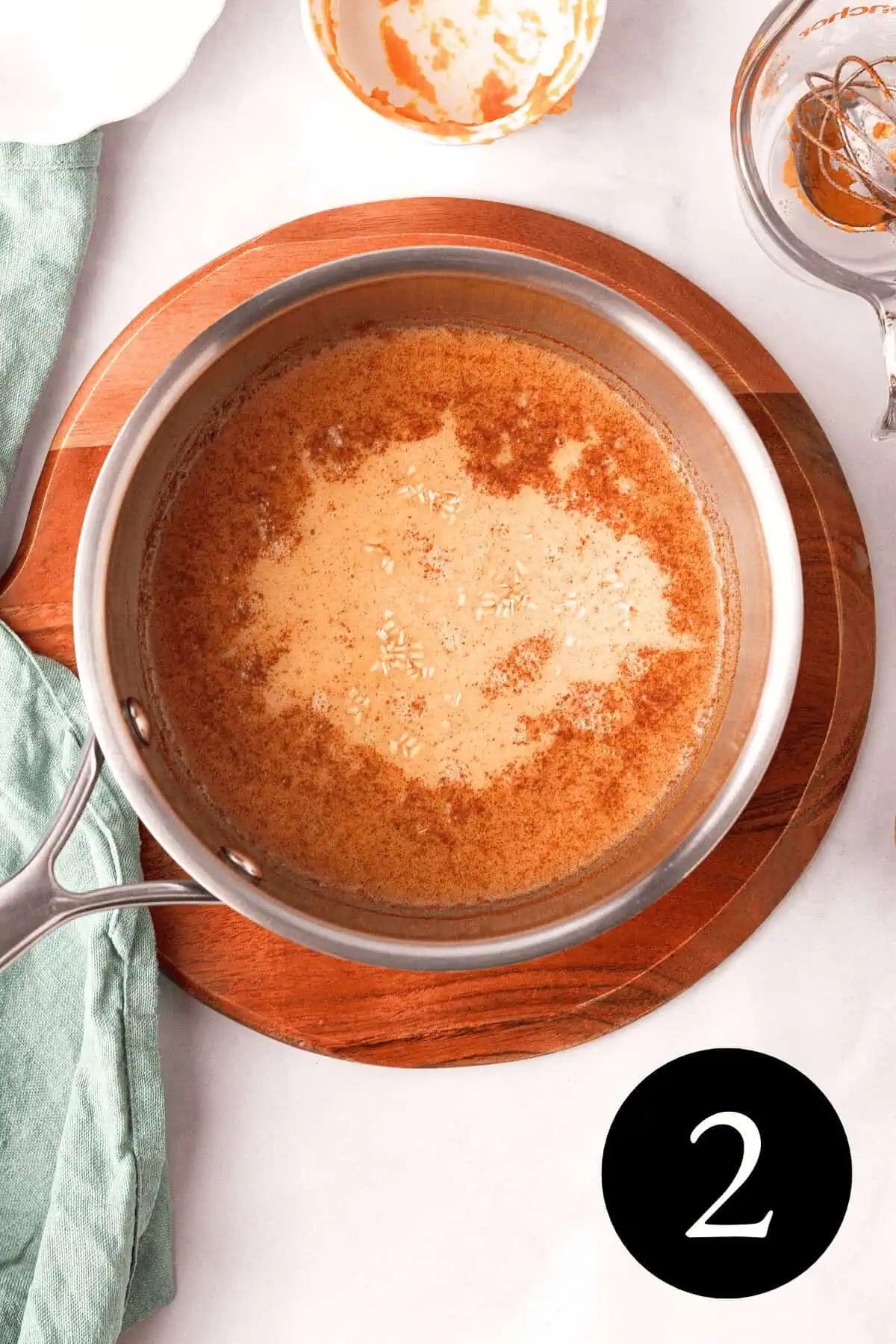 overhead image of oatmeal and cooking liquid in pan before cooking and number two in bottom right corner