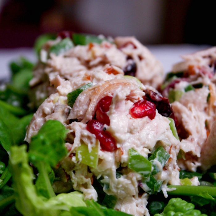 Close-up image of chicken salad scoop on bed of lettuce | hearth health happiness